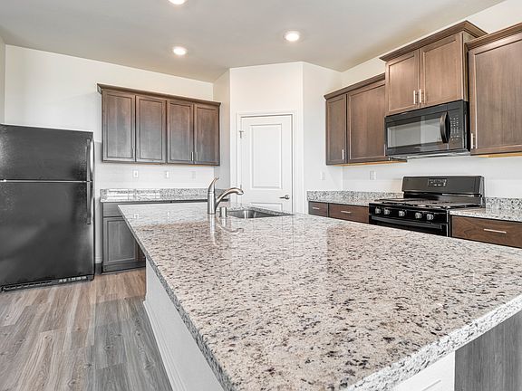 The kitchen comes fully loaded with a full suite of energy-efficient appliances.