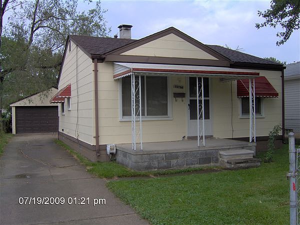 covered front porch & 2 car garage