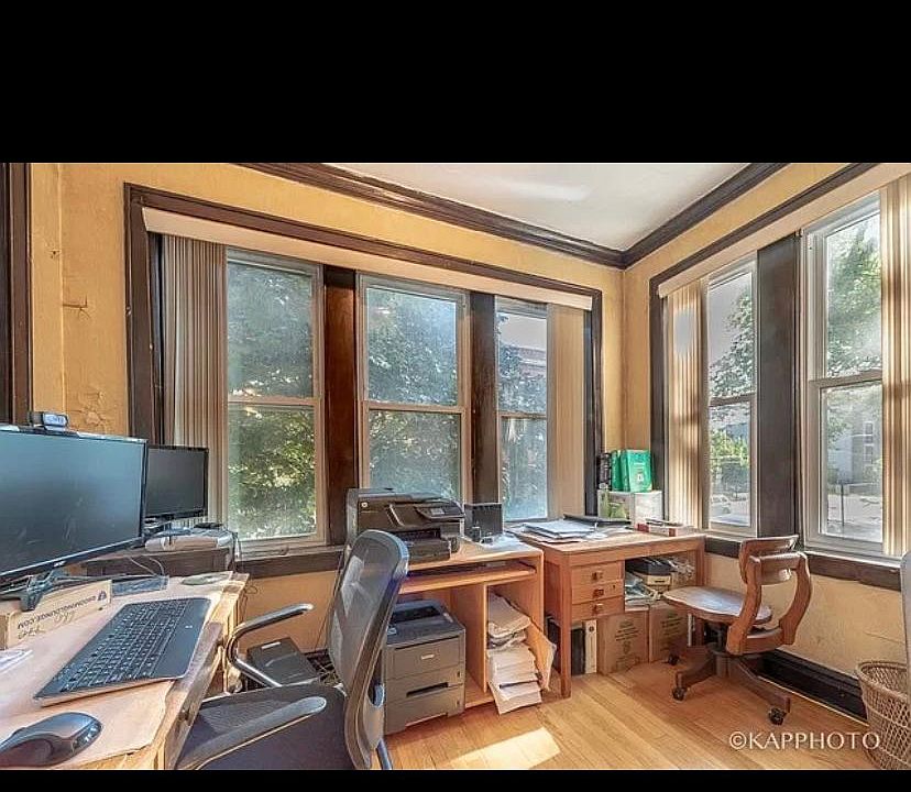 Sunroom 1, off of the LR; E, W, and N exposure