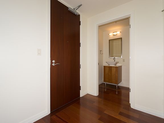 Welcoming Entrance with Powder Room & Coat Closet