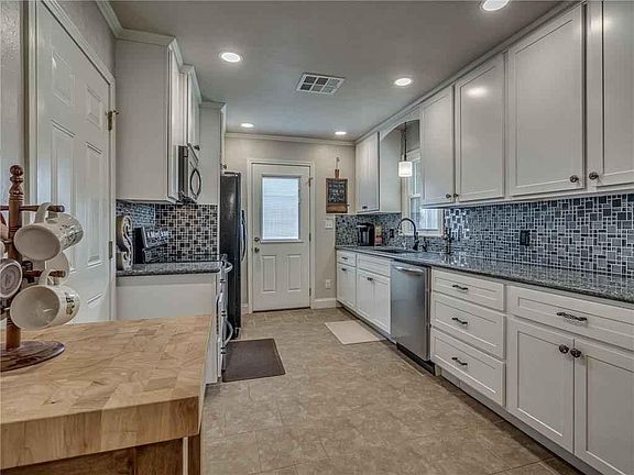 Beautifully renovated kitchen with granite countertops. All new appliances including microwave and refrigerator.