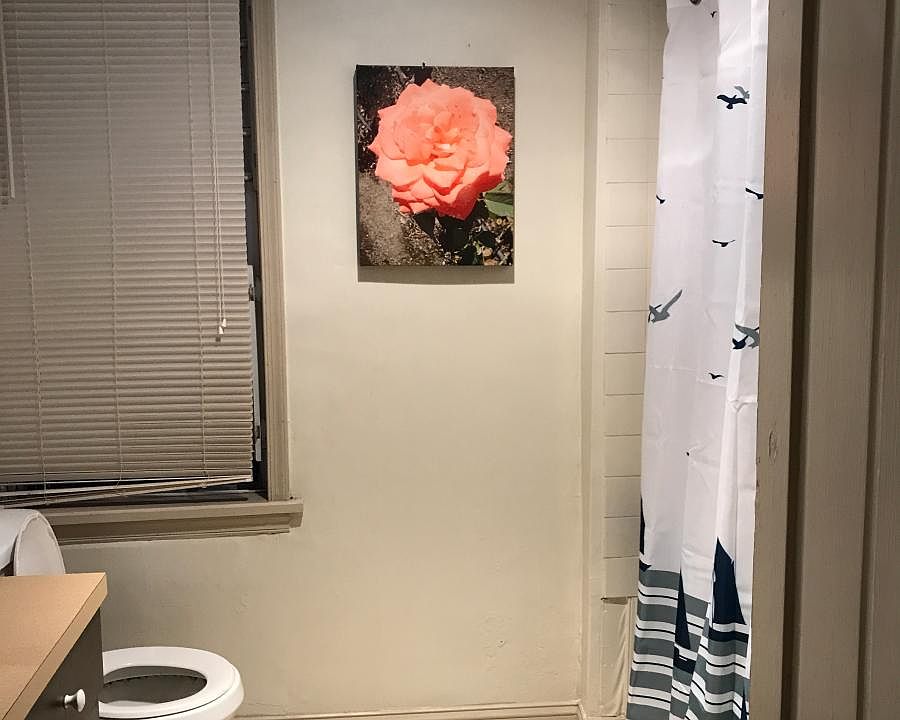 Bathroom with tub. Heat lamp in bathroom