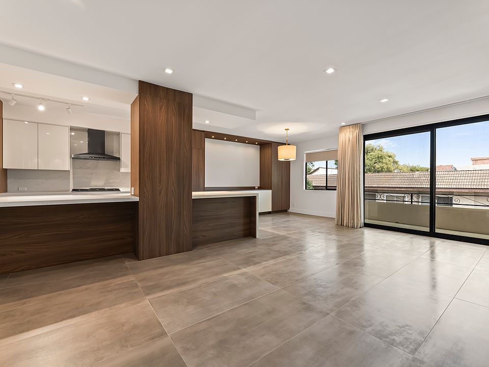 Living room, kitchen, dining room and outside patio.
