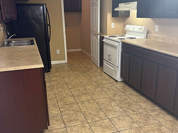Kitchen with view of laundry room.