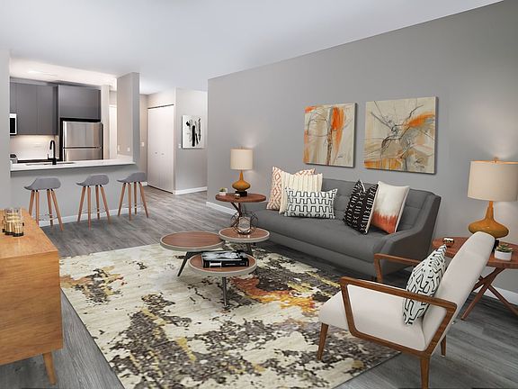 Renovated Package II living, dining, and kitchen areas with hard surface plank flooring