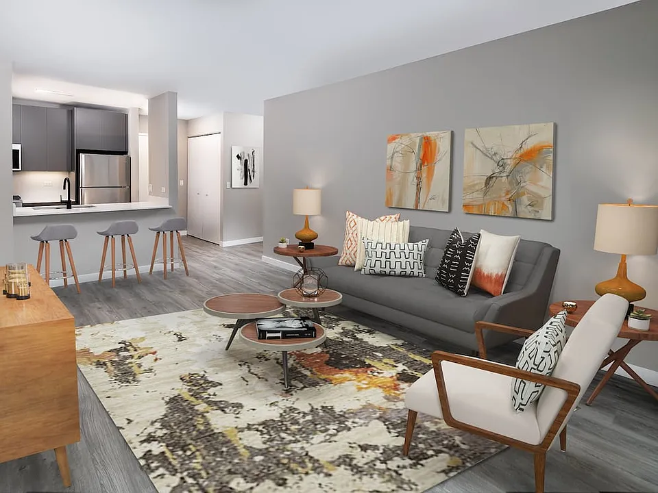Renovated Package II living, dining, and kitchen areas with hard surface plank flooring