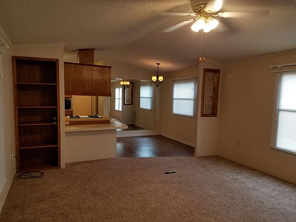 Living room, breakfast bar/desk, and dining area