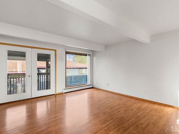 Living room with access to an exterior porch.