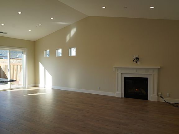 Open living and dining with vaulted ceilings