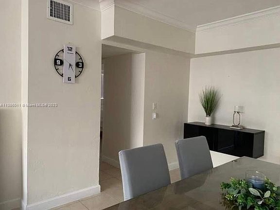 Dining Room with hallway leading to bedrooms and bathroom