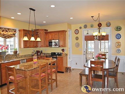 Upgraded kitchen (cherry cabinets, granite tops, & tile floor