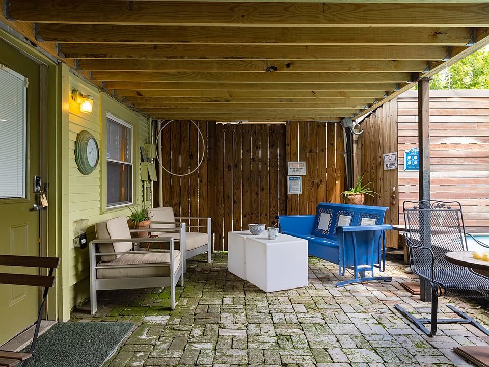 Covered Patio Entrance and Seating Area, Adjacent to Pool and Hot Tub
