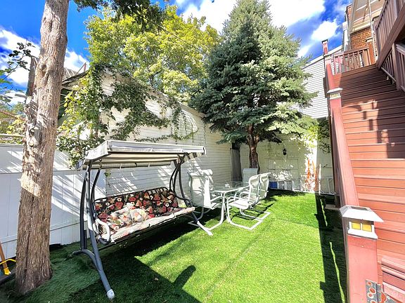 Shared backyard with furniture.