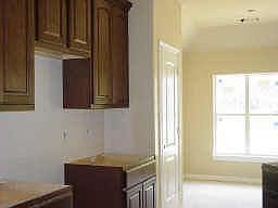 Kitchen with custom cabinets, granite counters and stainless appliances