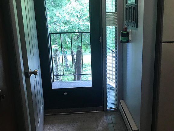 Entry Way- Kitchen to right. Master Bedroom behind this door on the left.