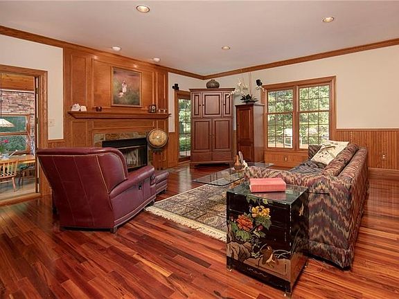 Large family room with log-burning fireplace (home is all electric.  no gas), recessed lighting, Brazilian cherry hardwood floor