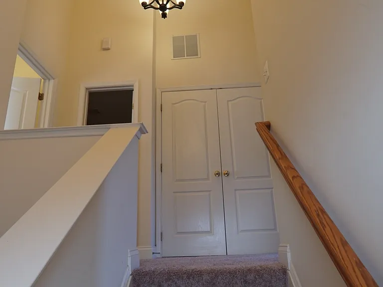 Stair view up to third bedroom level.