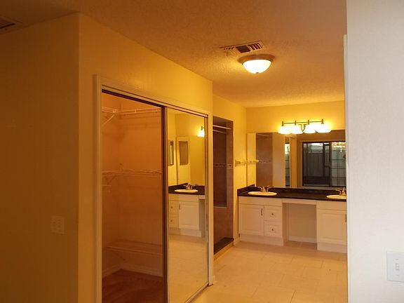 Master bedroom with 2 walk-in closets