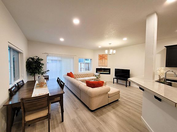 Dining area and living room and showing the kitchen island