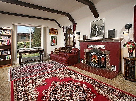High beamed ceilings and large windows