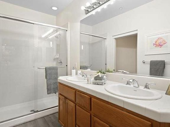Master bathroom- with double vanity and brand new medicine cabinet and floor