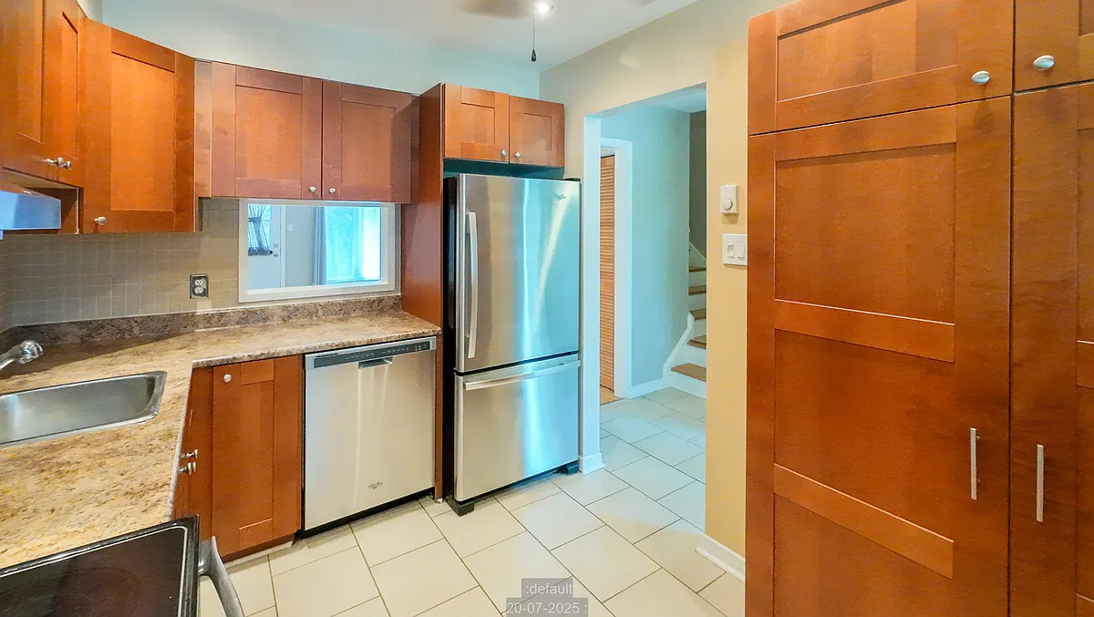Bright renovated kitchen with stainless steel appliances and ample updated cabinets including pantry. - 1342 Cedarcroft Cres