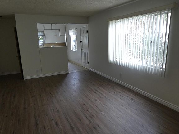 Large living room with natural light.
