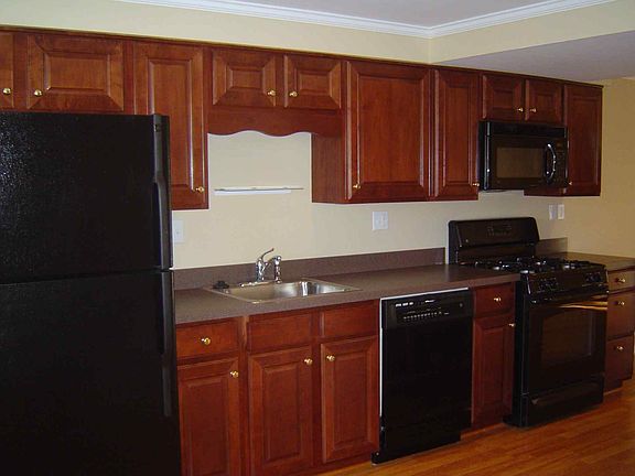 Cherry Cabinets with Black Appliances