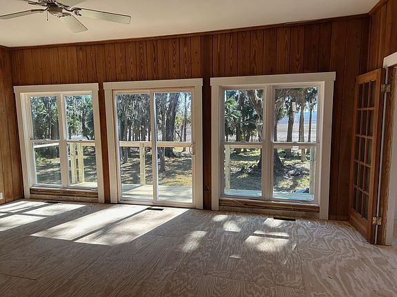 Living room overlooking the marsh next to den area