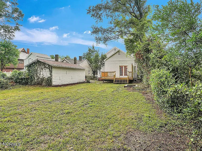 *original listing photo from when we purchased the home (backyard)