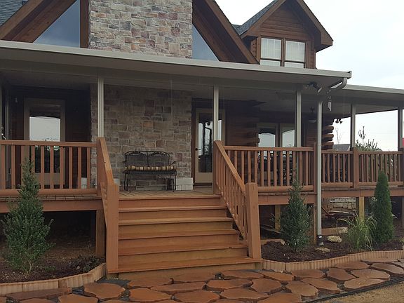 spacious back porch with ceiling fans