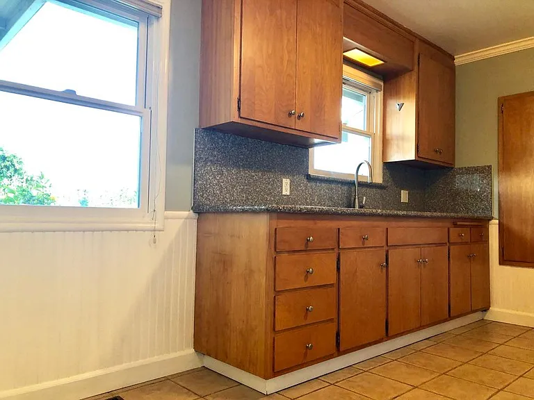 Kitchen, granite countertiop, SS sink, wainscoting