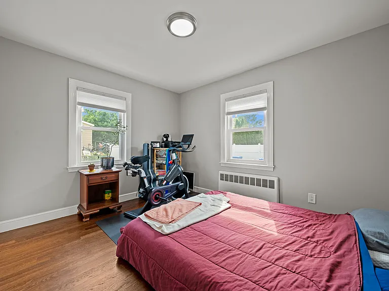 Slightly smaller bedroom with standard size closet, storage shelf up top.