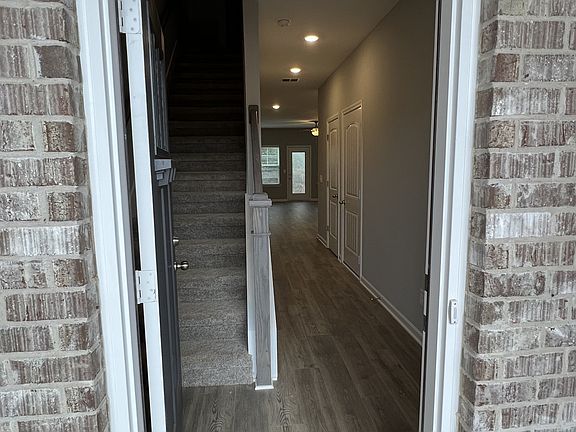 starting at the front door, the entire 1st floor is in laminate flooring