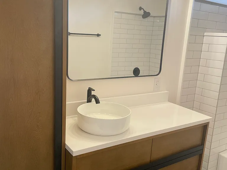 Bathroom with all new flooring, vanity, cabinet, tub, tile, shower, hardware, and toilet. Never been used.