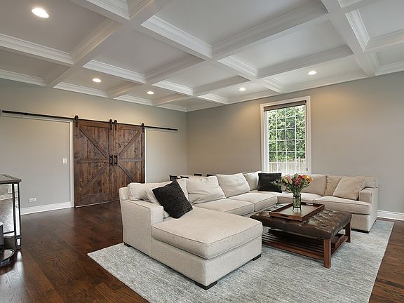 Family Room with coffered ceilings and can lites 