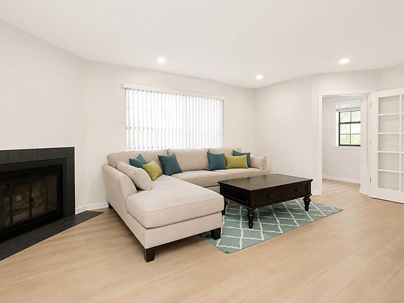 Family Room with Fireplace. NEW flooring and paint throughout