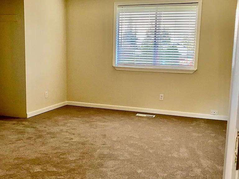 Master bedroom ceiling fan new carpets and paint throughout entire house .