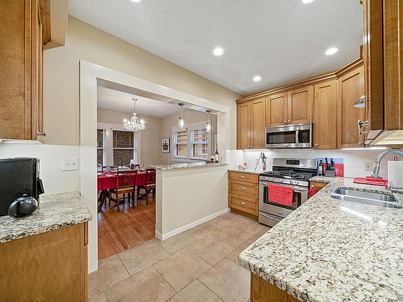 Kitchen opens to dining/living.