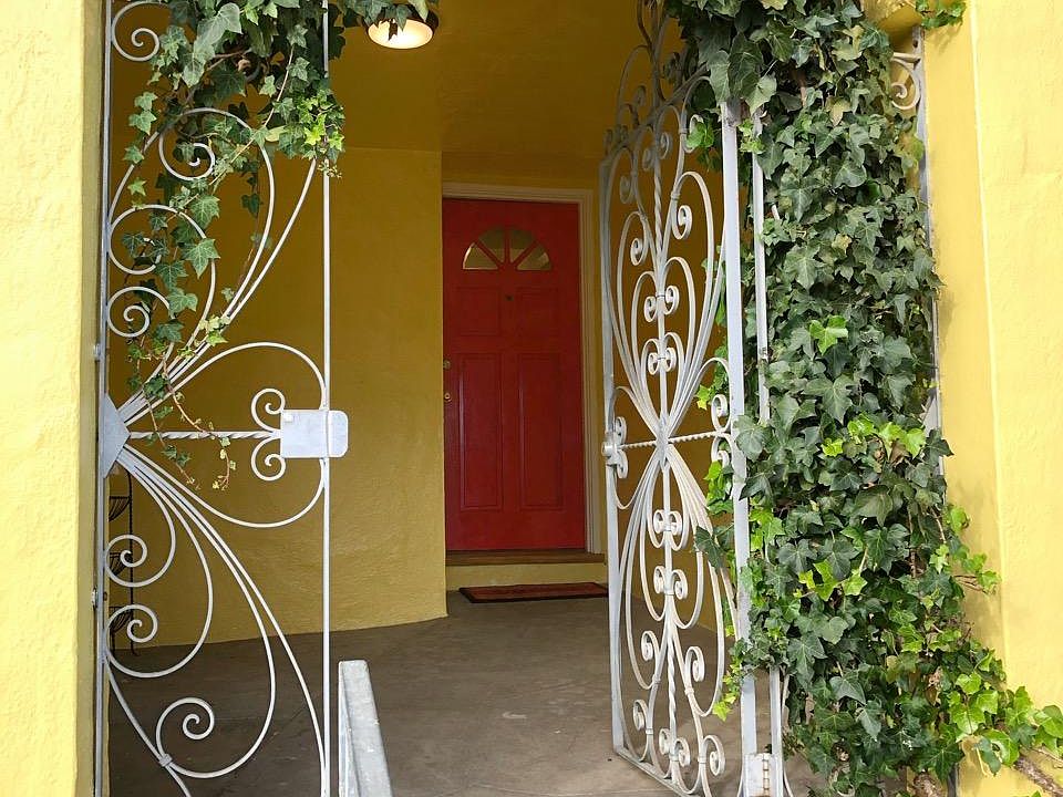 Enter through the ivy covered gate, to step into your warm and cozy two bedroom, one bath home