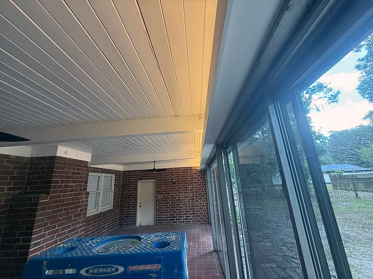 Florida room showing new valence with space for new light filtering blinds with remote control for motors to open and close blinds