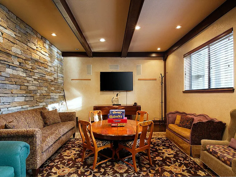 Step into this cozy living space designed for relaxation and entertainment.