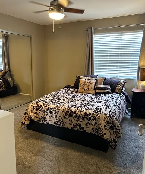Master bedroom with room darkening drapes and large closet