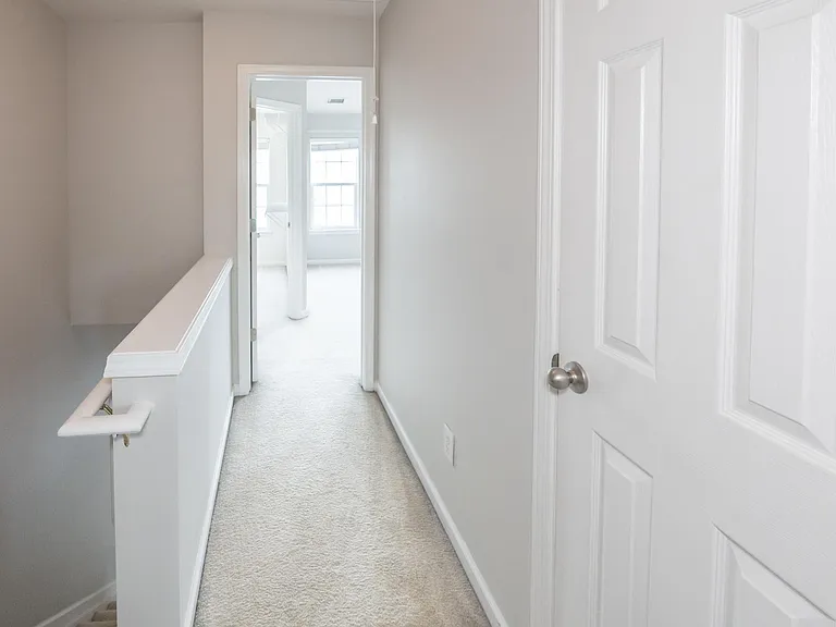 Notice the separation in the hallway to the second master bedroom. Also a linen closet is to the right between the two master spaces for convenience.