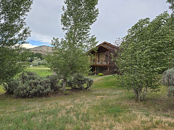 Deck on west side of home with doorway to bedroom #2 or office