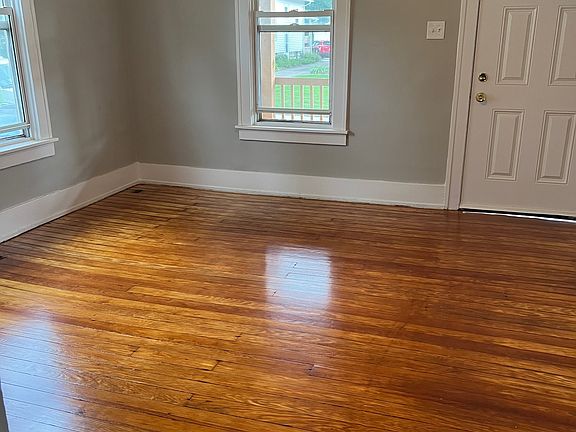 spacious living area with refinished hardwood floors