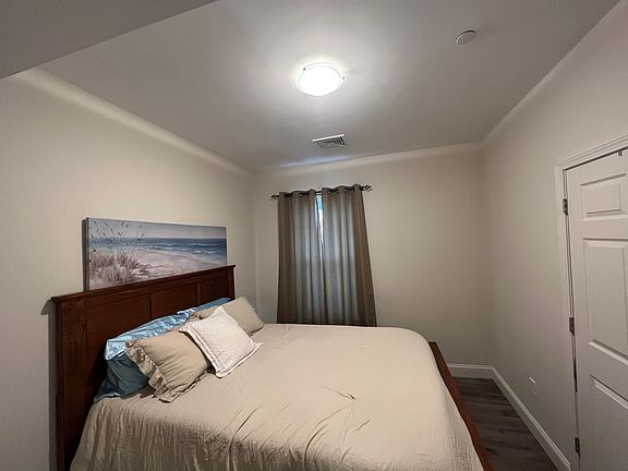 Bedroom one, queen size bed for reference and one closet