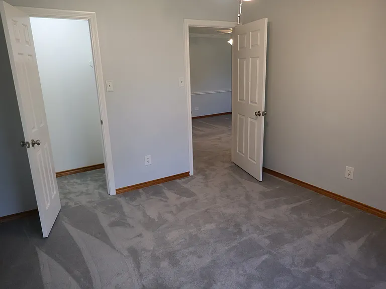 Bedroom #4 with ceiling fan and walk-in closet.