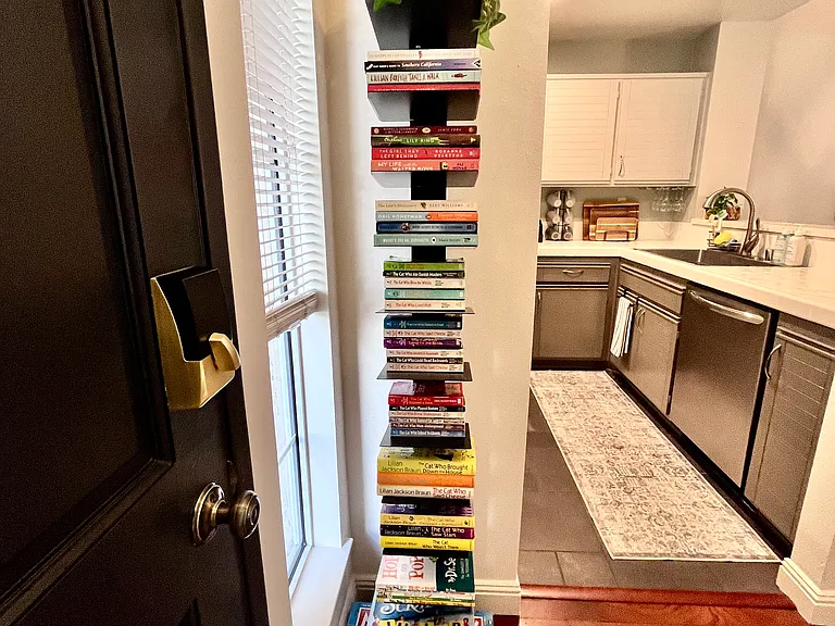 Thoughtfully curated mini library with bestsellers, travel guides, childrens classics, and popular board games plus junior editions for family fun and relaxation.