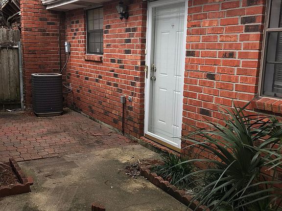Open air "back" patio between garage and door is ready for your grill or boil pot.